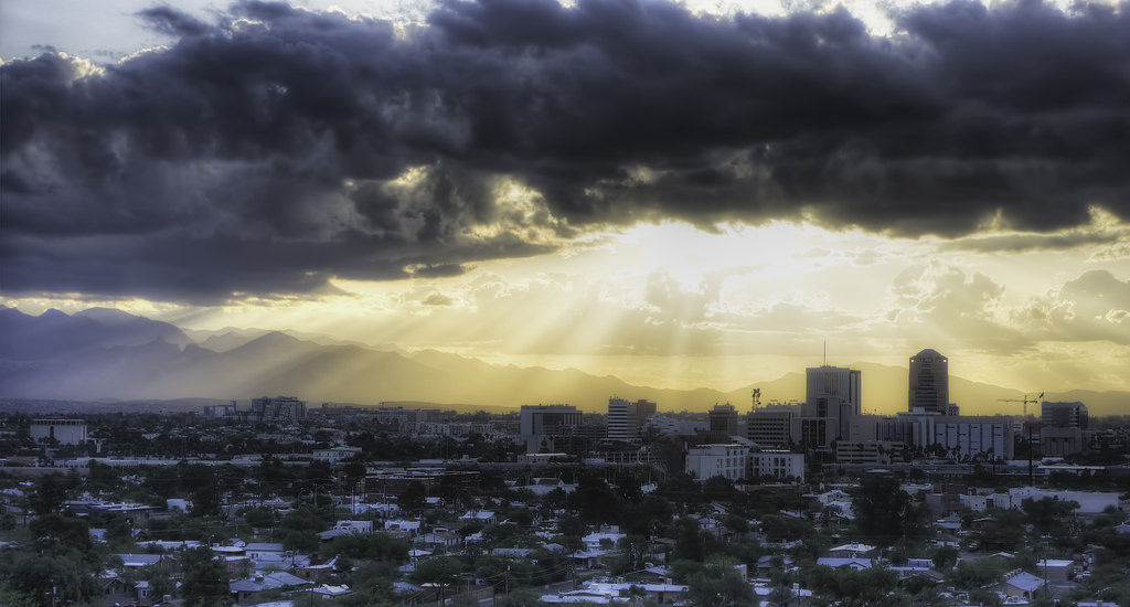 city mountain sunrise clouds